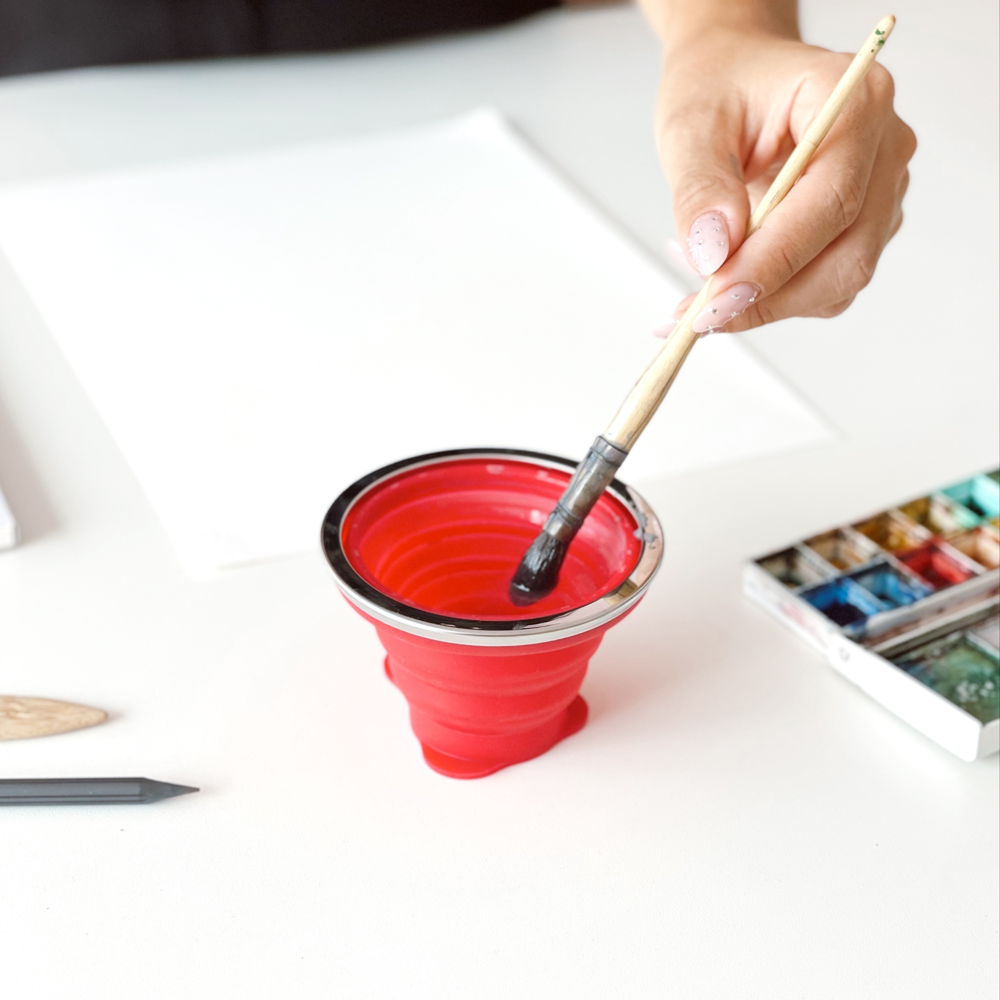 water cup, painting cup in action water cup, painting cup in action