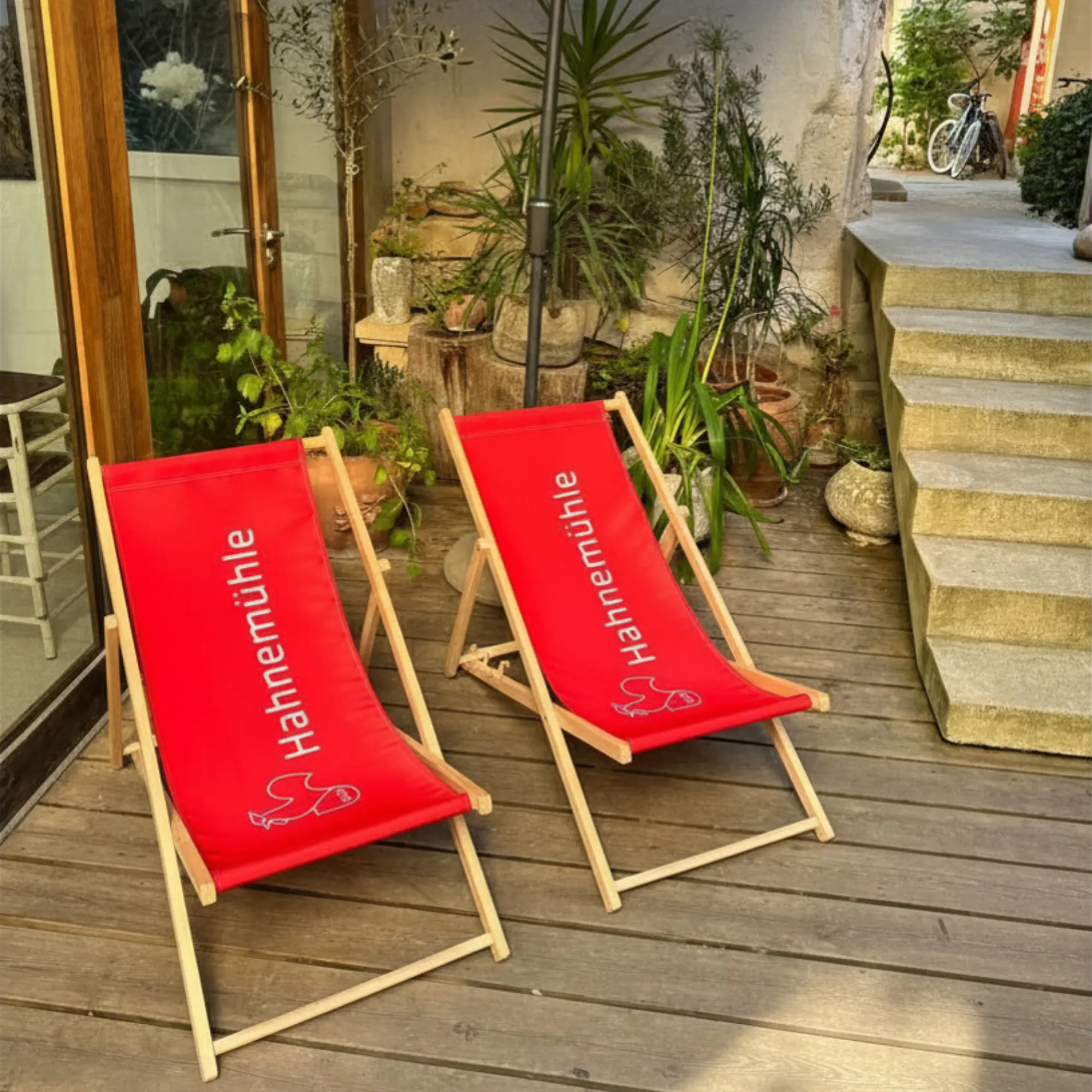 deck chair, outdoor furniture, red fabric, wooden frame, folding chair